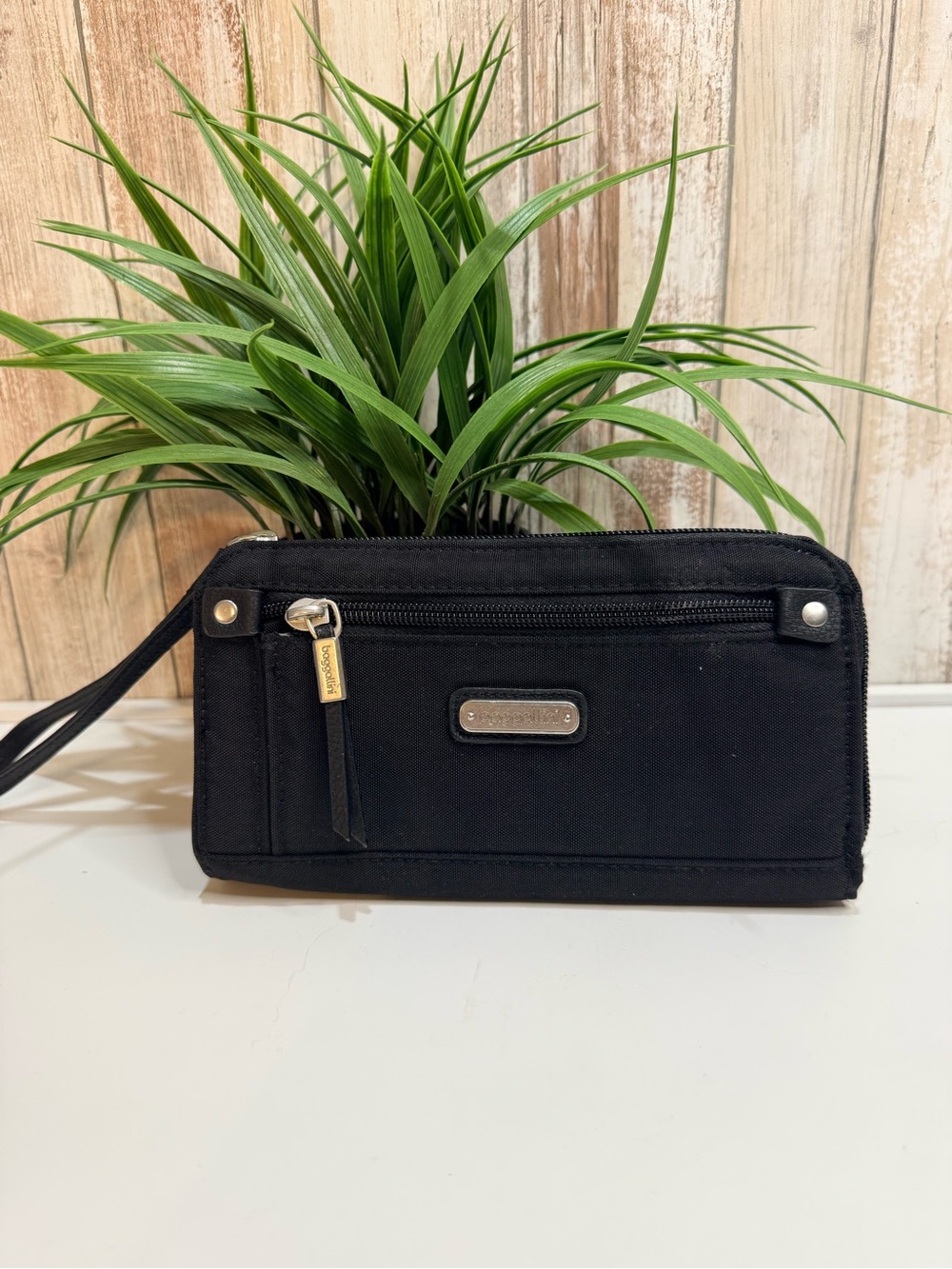 Baggallini Zip Around Wallet featuring a wrist strap and RFID protection, Black